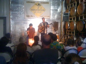 Martin Paris performing at Sculpterra Winery in the barrel room.