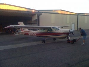 Bassist, inventor and pilot Peter Sanford prepping his aircraft for flight.