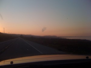 If you can see through the dead bugs on the windshield, you'll see the warm, morning glow along CA-1 and the craggy, generally surf-rich, coastline. Stunning!