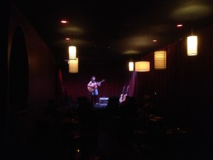 Jamie Drake on the stage at Zoey's CafÃ© singing her hit, "Plumbline". Such a great tune...