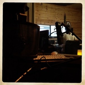 Listening back to a track from the iso booth in the studio with Adam Zelkind.