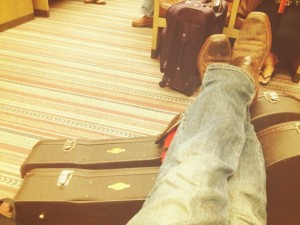 Kicking up my heels in the airport lounge in Albuquerque, New Mexico, waiting for another flight to another city and another show...